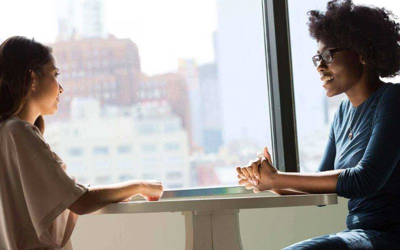 two friends talking together