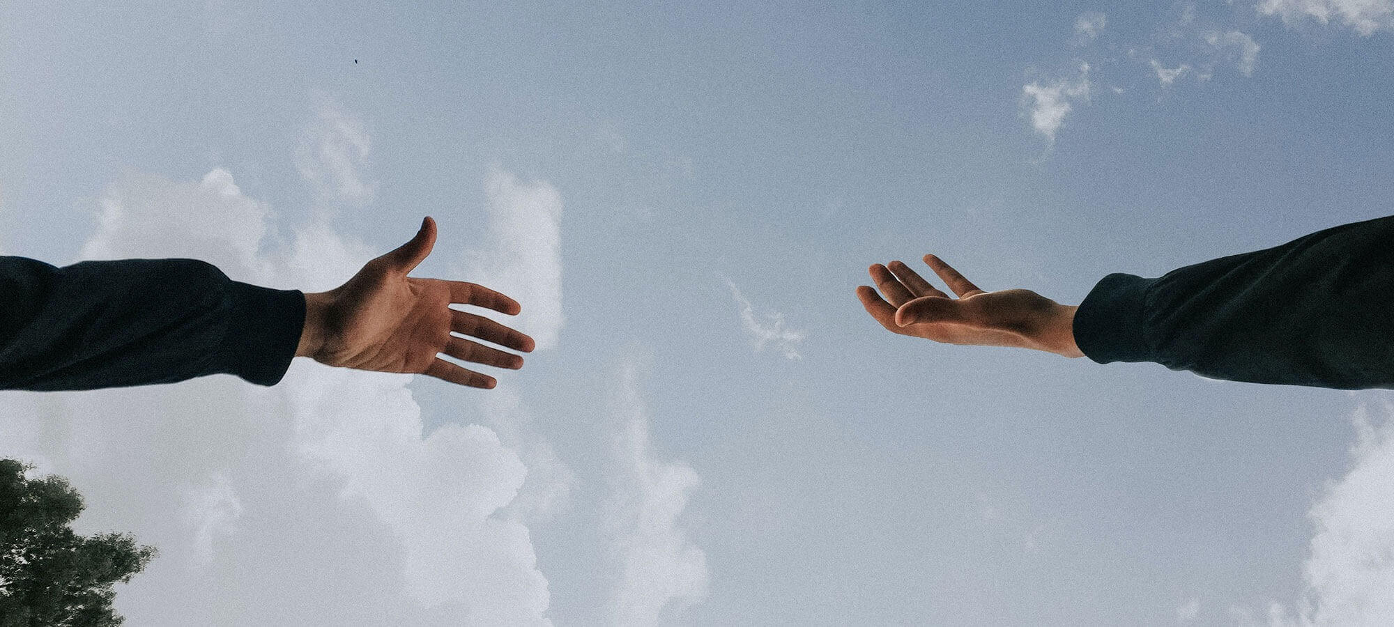 Hands reaching out for each other