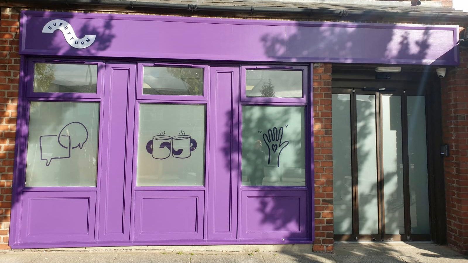 A purple shop-front showing Everyturn Mental Health branding